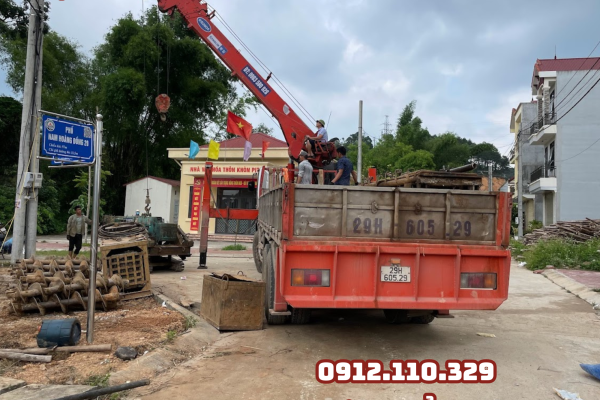 cẩu hạ máy móc